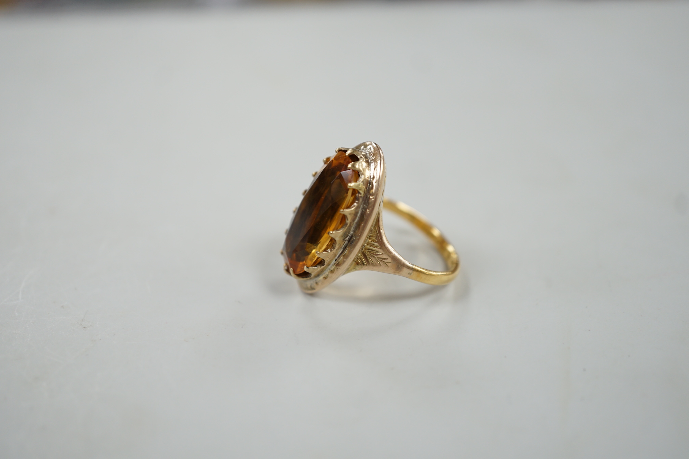 A 22ct gold and citrine set ring, composed from a 22ct gold shank and a George III mourning ring.